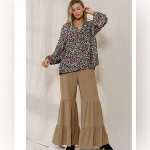 Solid woven tiered ruffle wide pants.